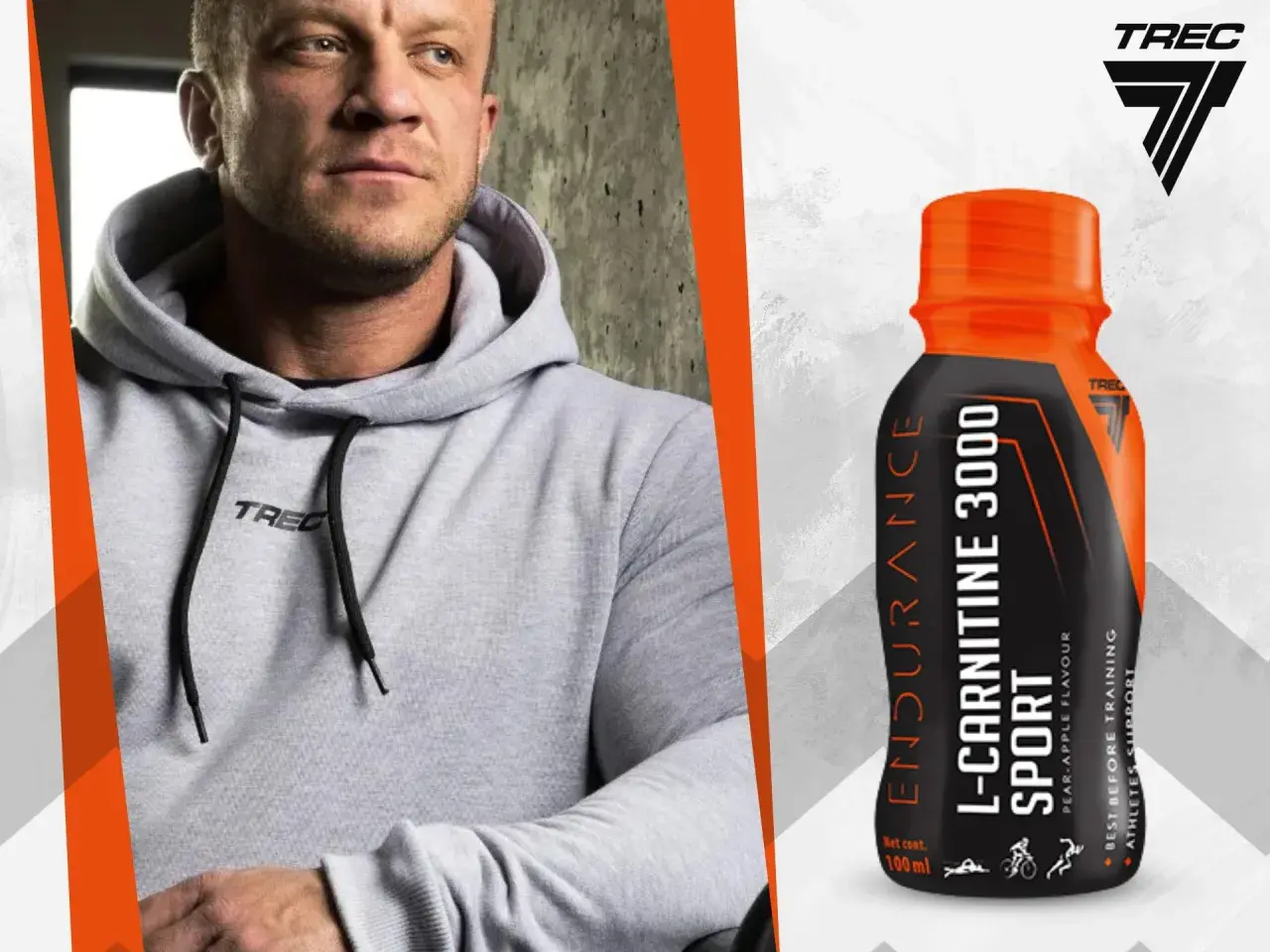 Mężczyzna w szarej bluzie z kapturem obok butelki L-Carnitine 3000 Extreme Shot o smaku gruszka-jabłko.